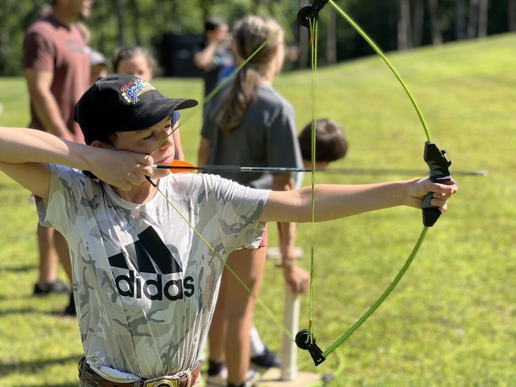 Young archer lining up a shot.