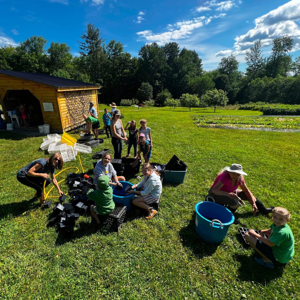 Volunteers at Abundance Acres participating in a pot wash